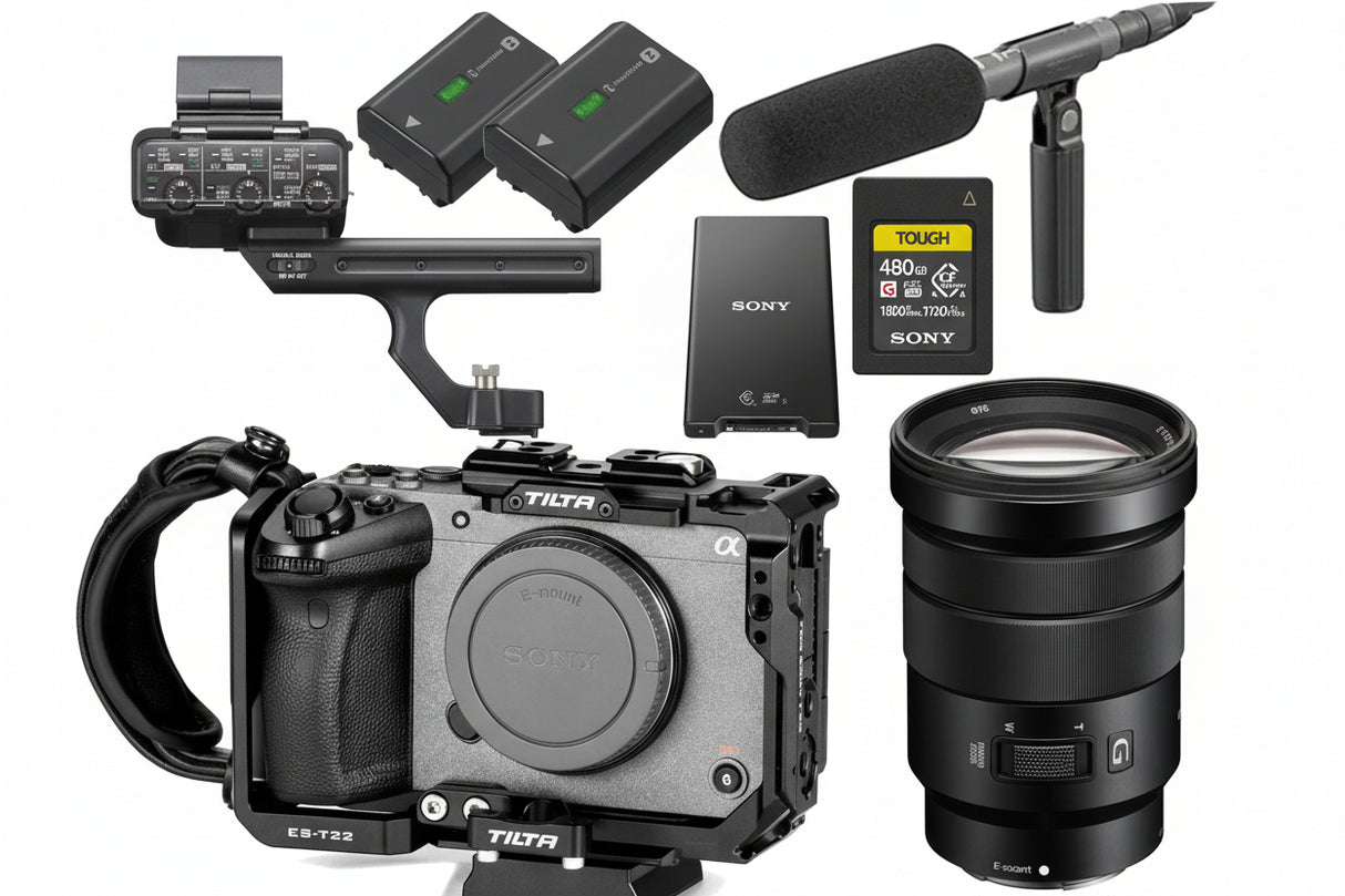 Camera equipment including a camera body, lens, microphone, and accessories on a white background