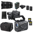 Sony professional video camera kit with a black camera body, lens, battery, charger, batteries, memory cards, speaker, and carrying bag on a white background.