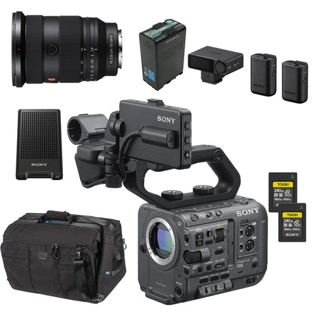 Sony professional video camera kit with a black camera body, lens, battery, charger, batteries, memory cards, speaker, and carrying bag on a white background.